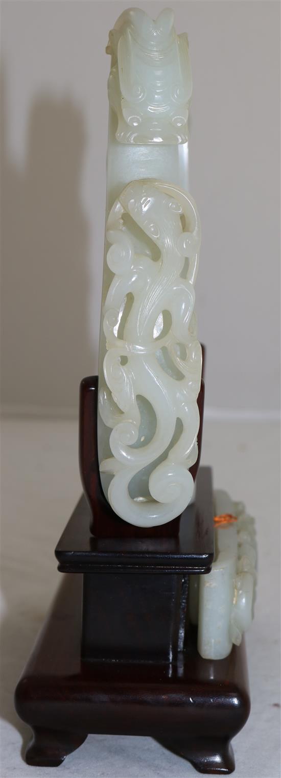 A collection of Chinese archaistic pale celadon jade belt fittings and a white jade archers ring, 17th-19th century,